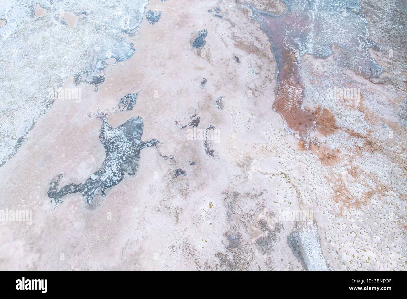 Aerial view of saline textures in Salar de Pocitos, La Puna, Argentina highlights abstract patterns and natural formations from a drone's perspective Stock Photo
