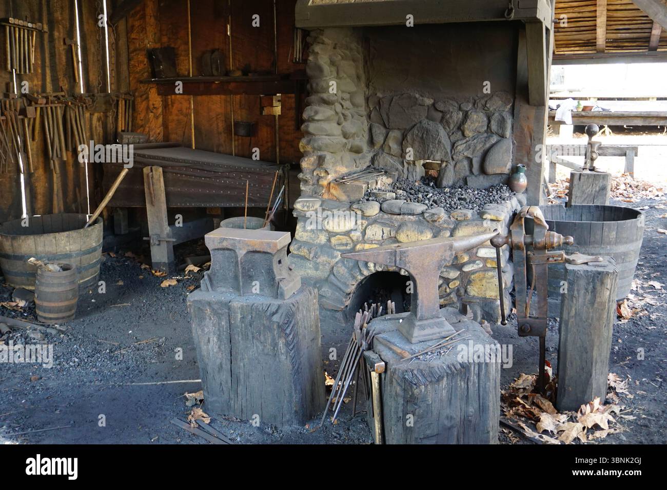 Inside the authentic old blacksmith shop or forge with an anvil and ...
