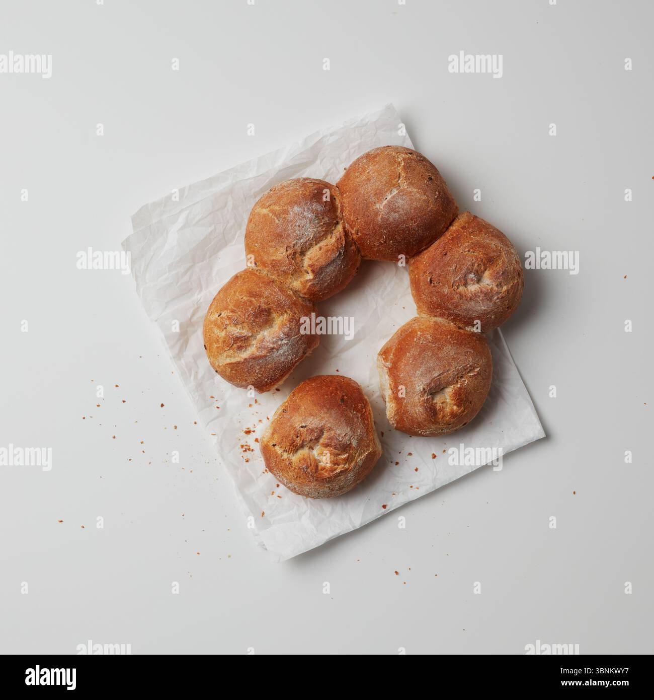 Chocolate round donuts on white paper Stock Photo