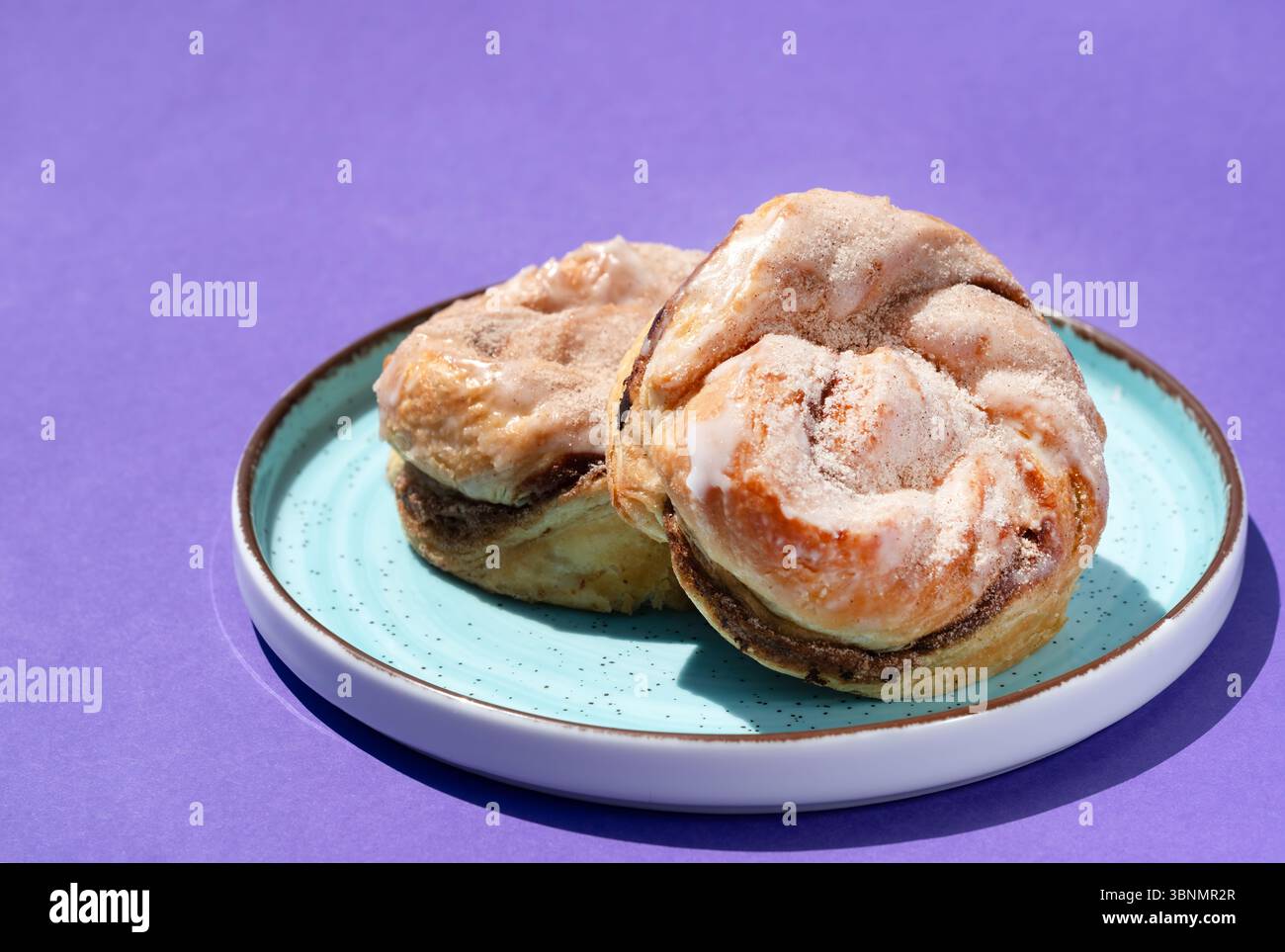 UK. A close up image of cinnamon rolls or buns on a plate. Stock Photo