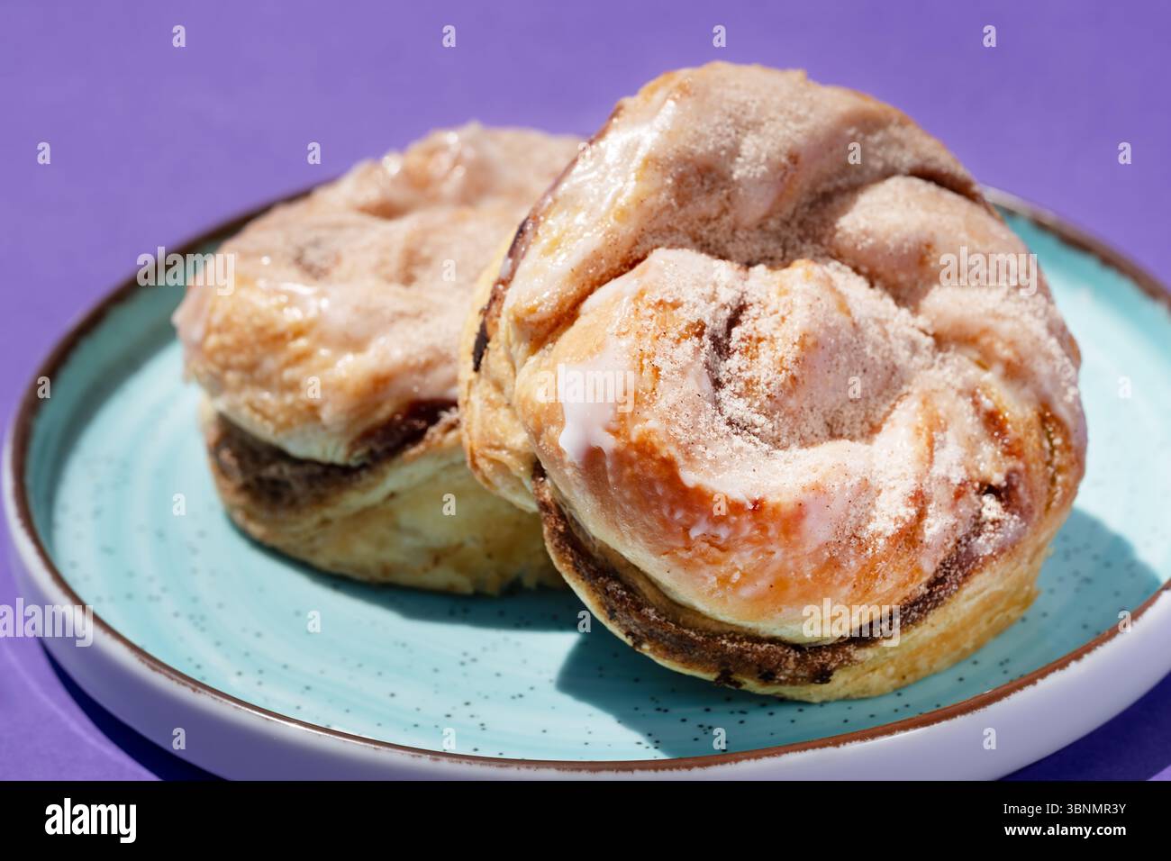 UK. A close up image of cinnamon rolls or buns on a plate. Stock Photo