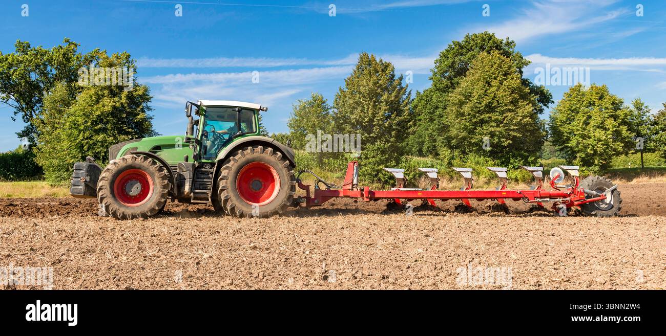 Tractor with 6-share reversible plow in the field - 0746 Stock Photo ...