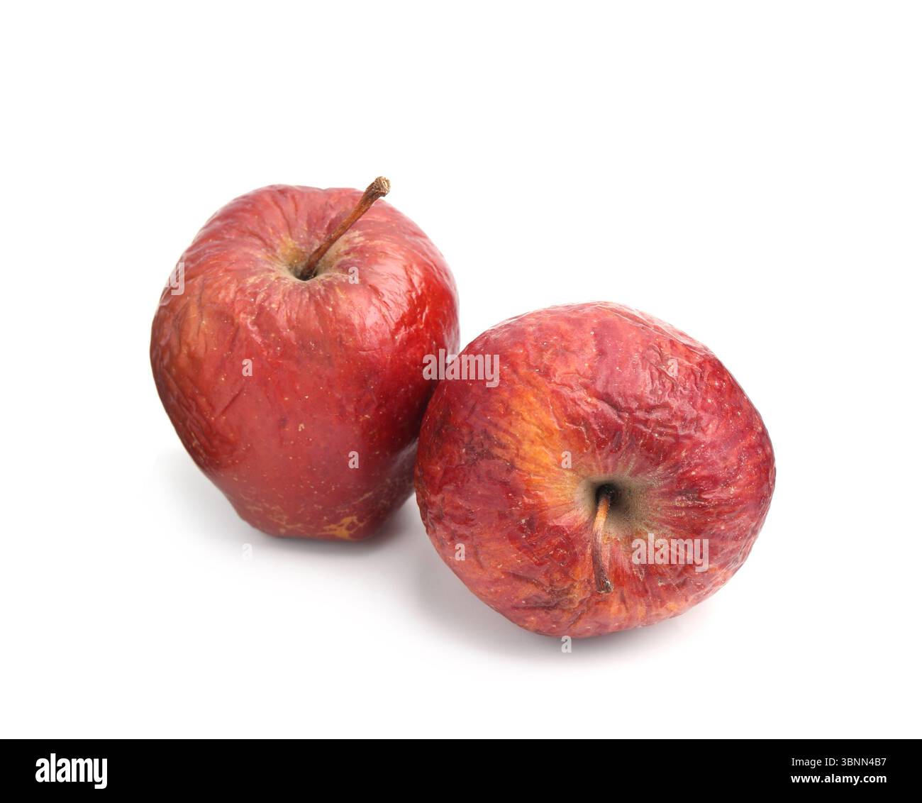 Two whole rotten apples isolated on white Stock Photo - Alamy