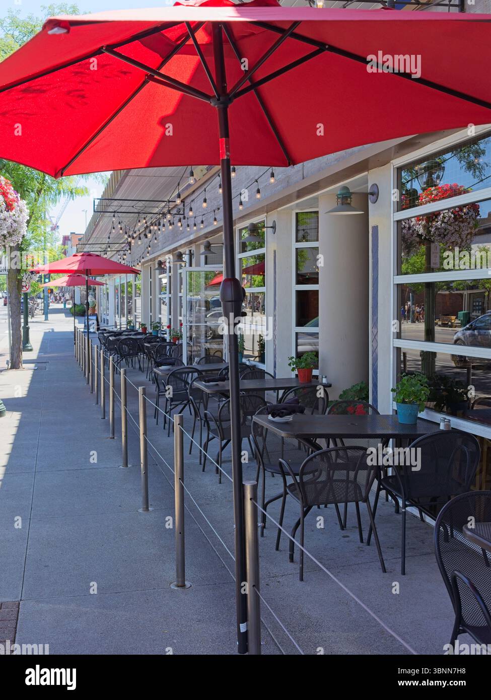 a-street-photography-image-of-empty-tables-before-opening-outside-a