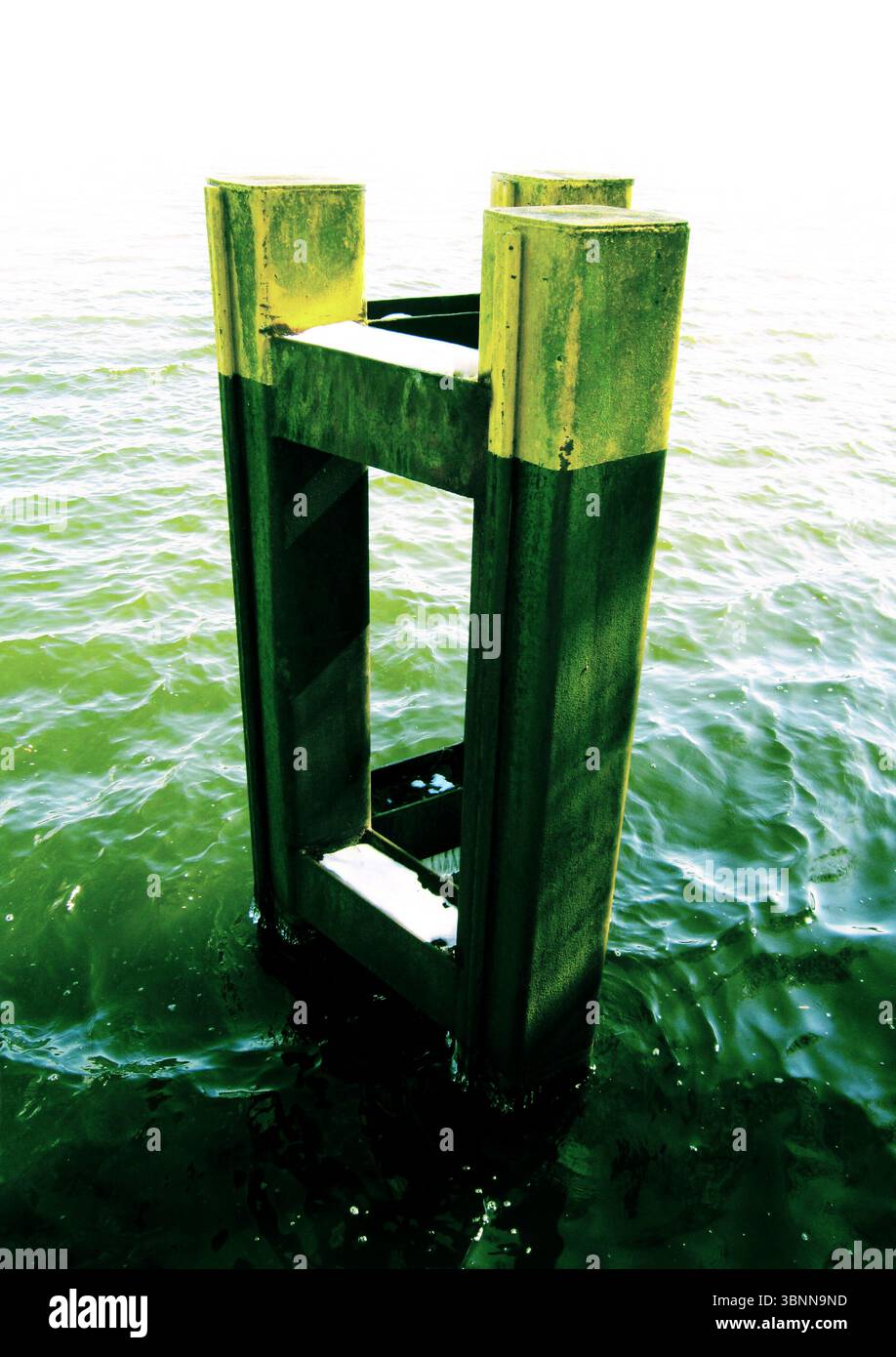 A metal pillar in the water, marker, waves, Stock Photo