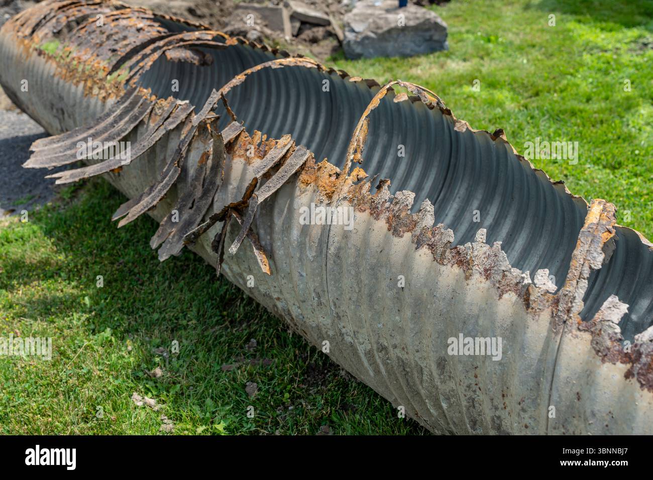 Infrastructure photo of rusted out corrugated metal pipe, CMP, drainage ...