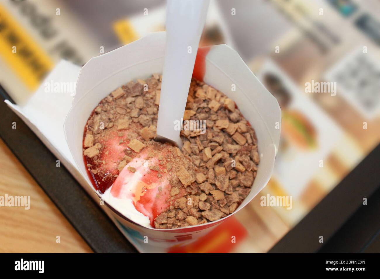 McFlurry is a soft-serve ice cream. Strawberry ice cream in a paper cup ...