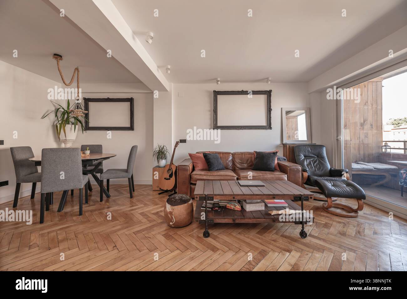 Typically, the sofa faces a focal point, such as a fireplace or television. Stock Photo