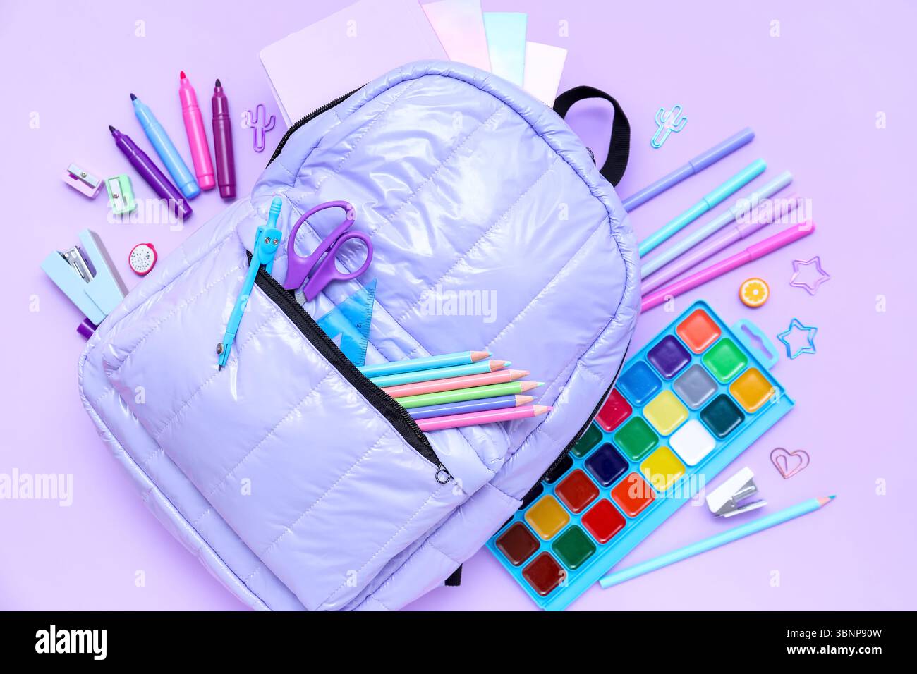 Composition with stylish school backpack and different stationery on lilac background Stock Photo