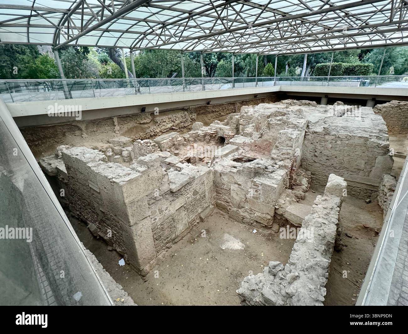 Ancient ruins preserved under a protective structure in Athens, Greece, reflecting the city's deep historical legacy. - Smartphone Captured Stock Image