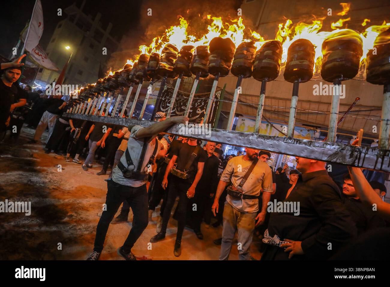 Najaf, Iraq. 03rd July, 2025. Shiite Muslims perform mourning rituals ...