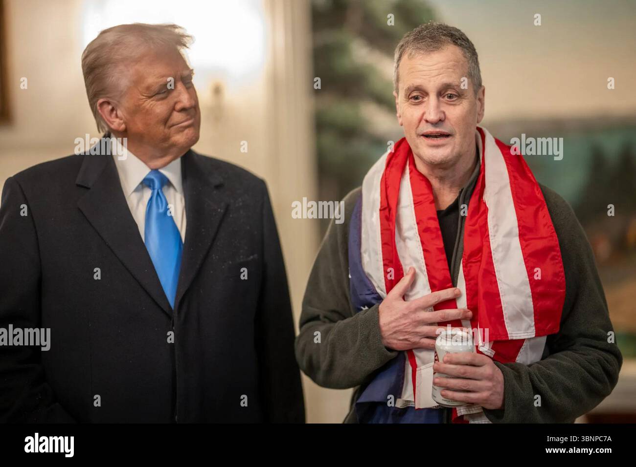 President Trump listens to Marc Fogel after securing his release from Russian detention. February 11, 2025. Image furnished by the White House. Stock Photo