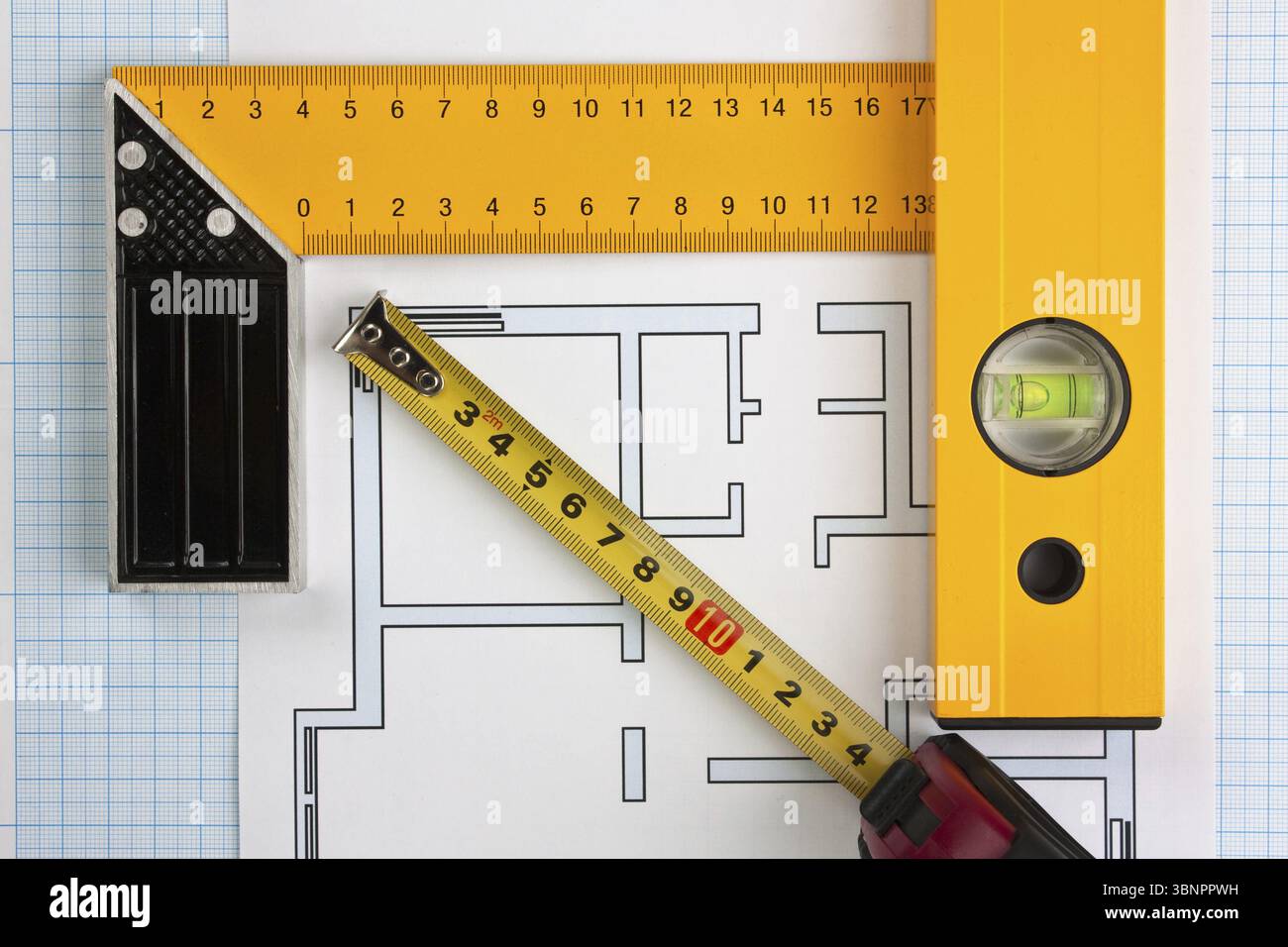 Development drawings and tools on graph paper Stock Photo