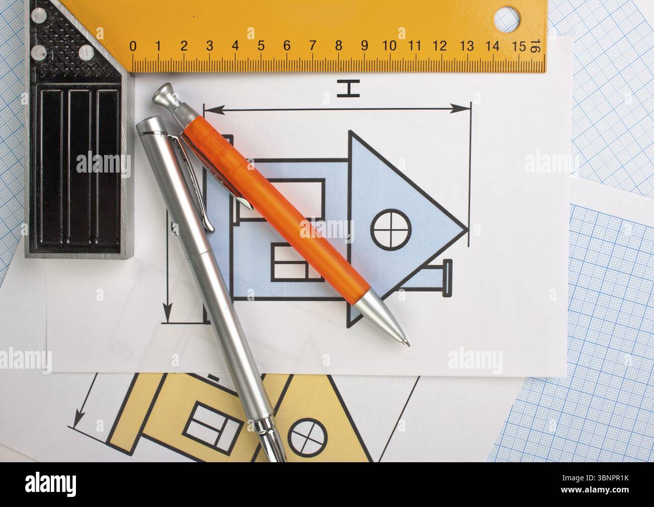 Development drawings and tools on graph paper Stock Photo