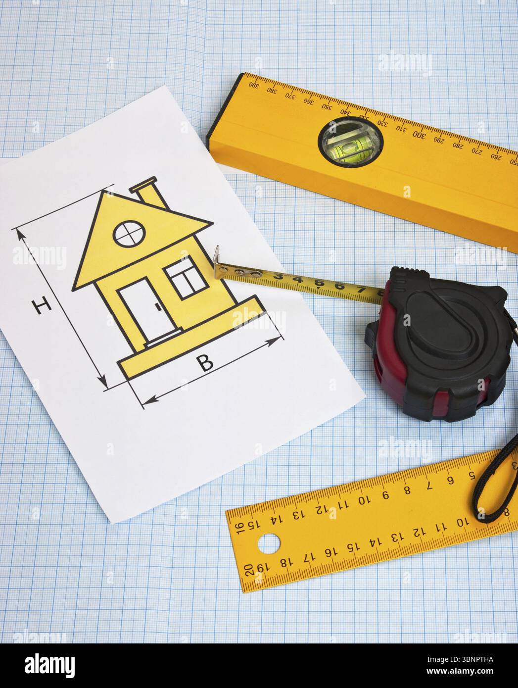 Development drawings and tools on graph paper Stock Photo