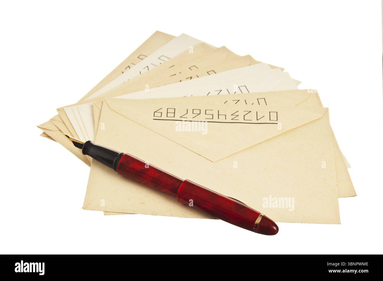 Stack of mail envelopes and a pen isolated on white background Stock Photo