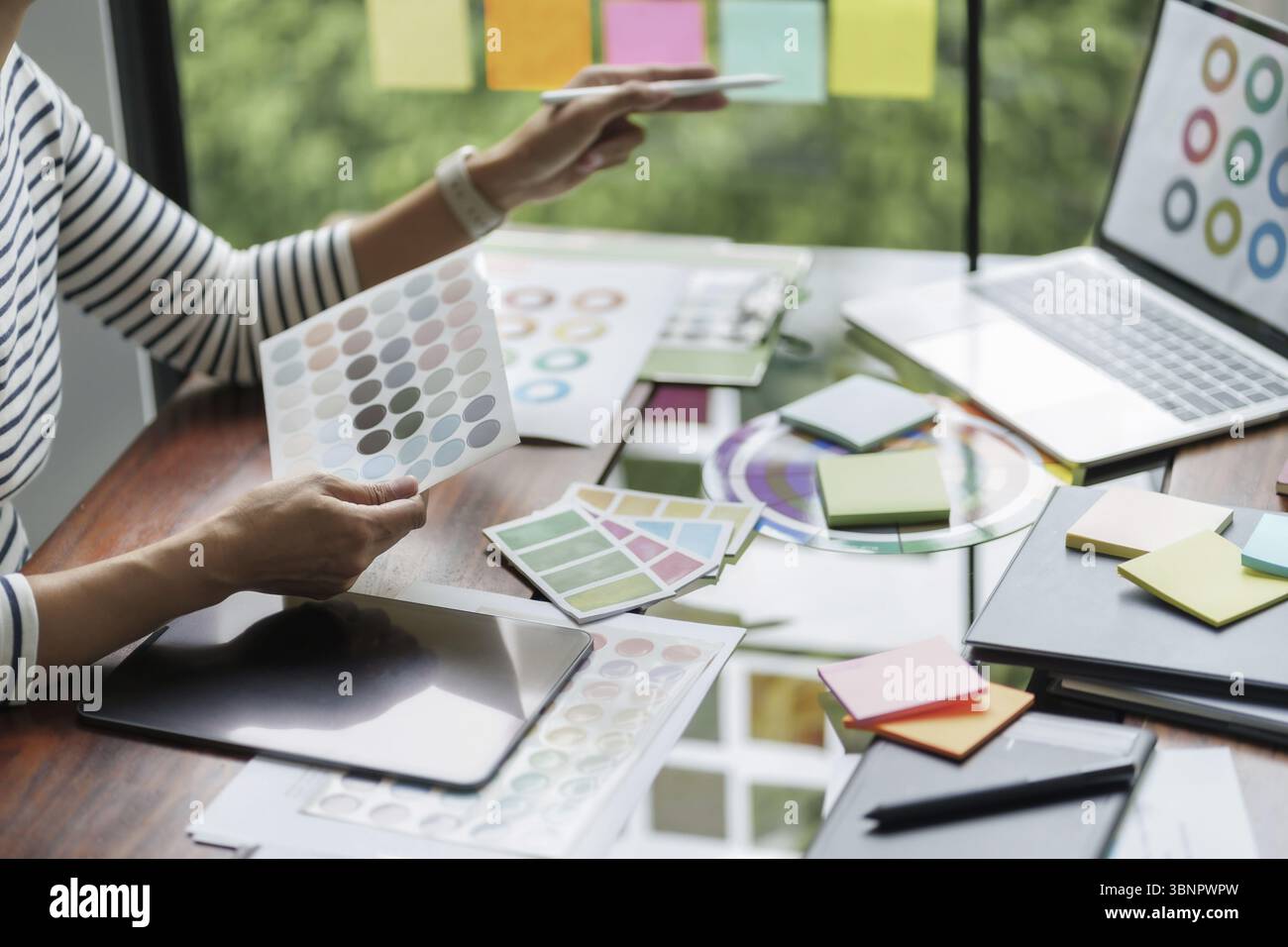 Working With Color Architects designer team working with color palette chart Stock Photo ...