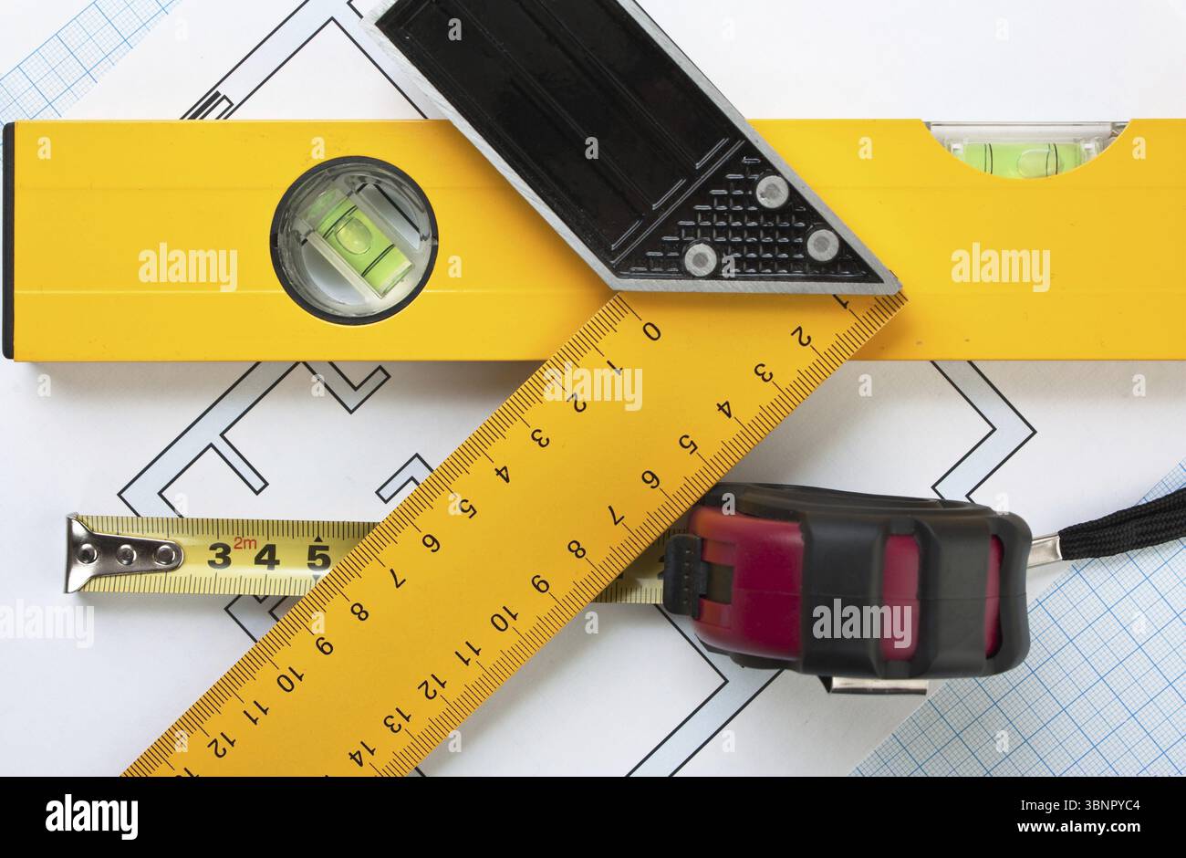 Development drawings and tools on graph paper Stock Photo