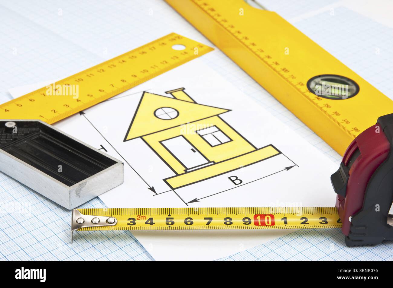 Construction drawings and tools on graph paper Stock Photo