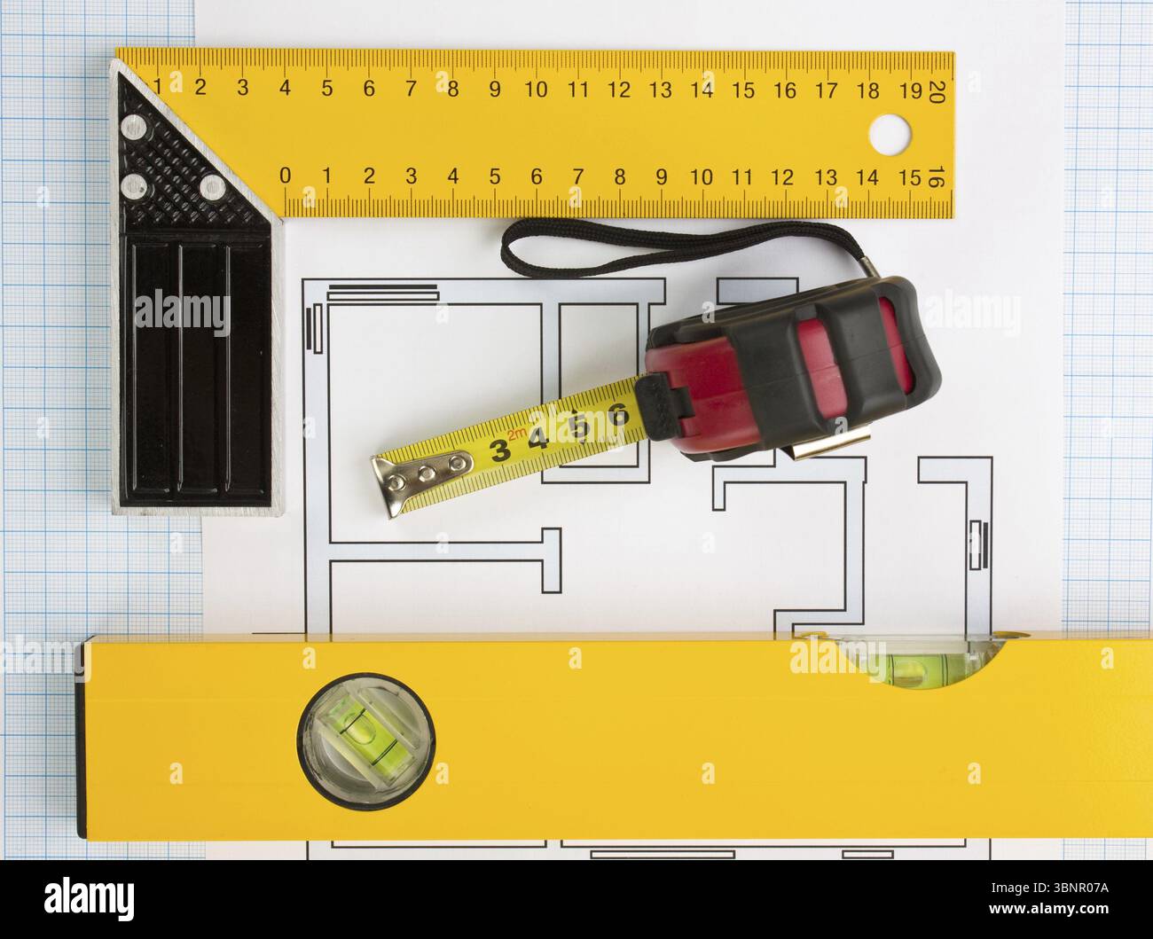 Development drawings and tools on graph paper Stock Photo