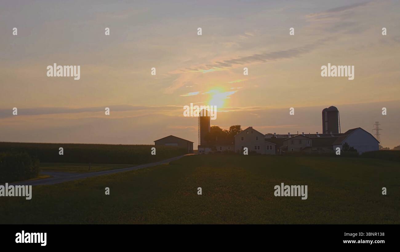 View of a Sunrise Looking over an Amish Farm with Farm House Barn and ...