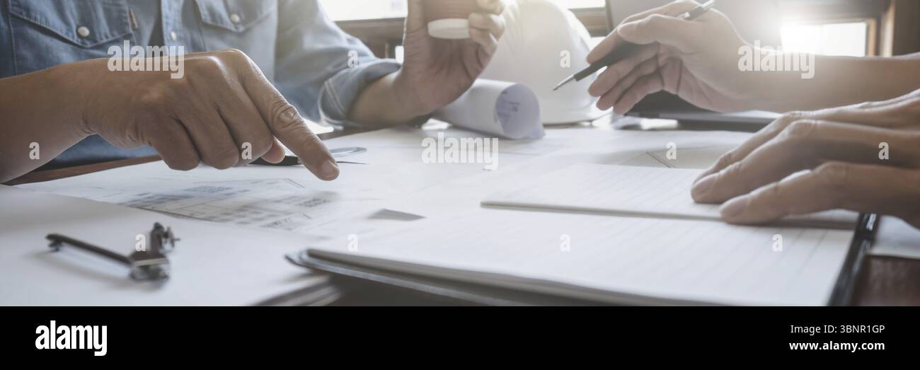 Architects interior designer hands working with Blue prints and ...