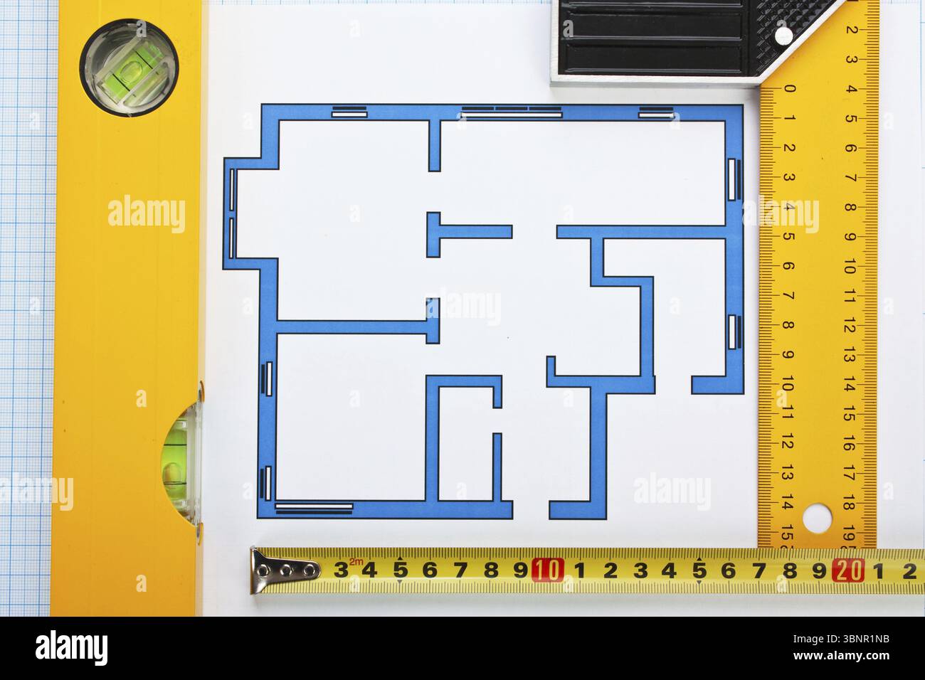 Development drawings and tools on graph paper Stock Photo