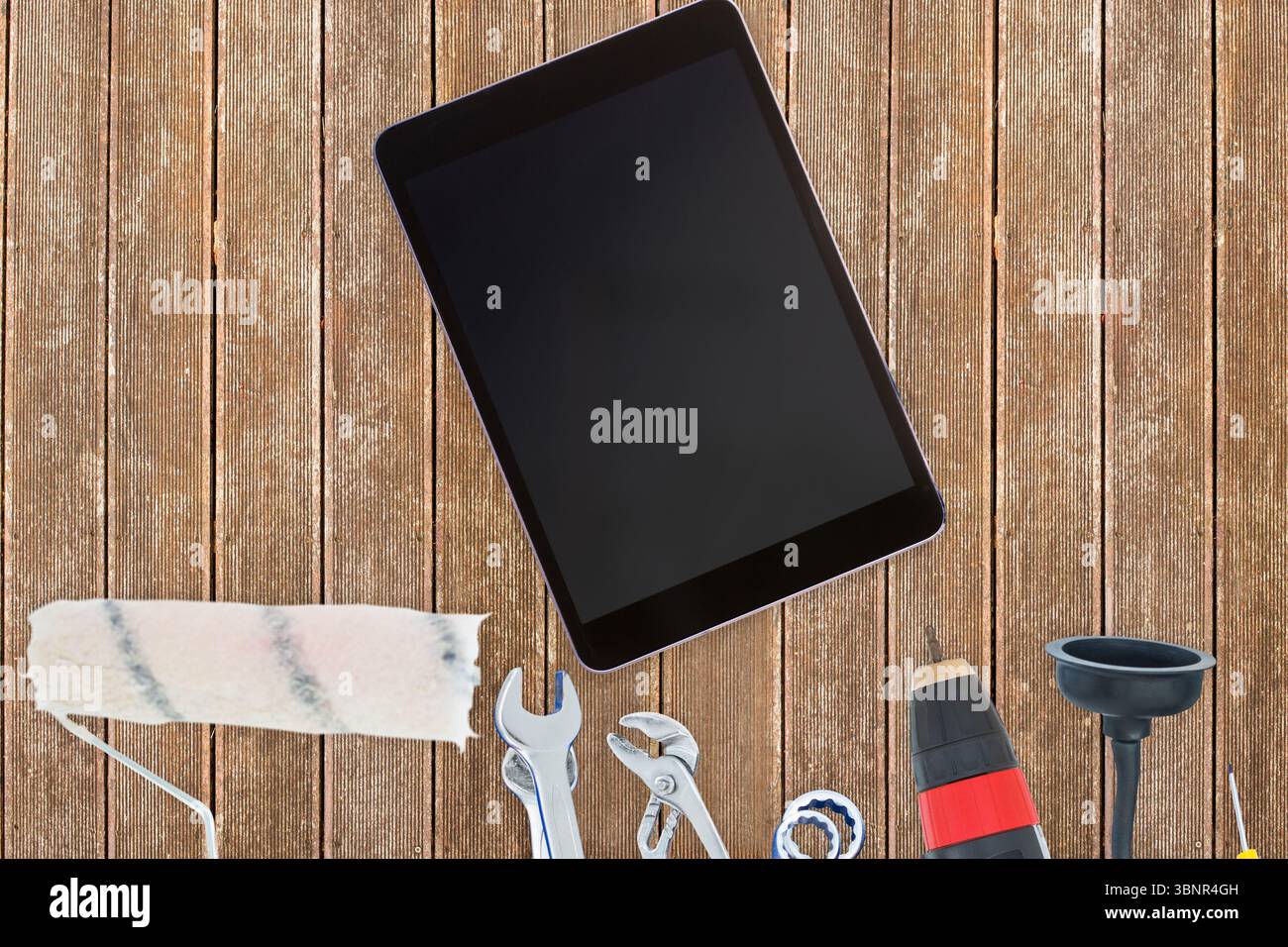 Tools and tablet on wooden background Stock Photo