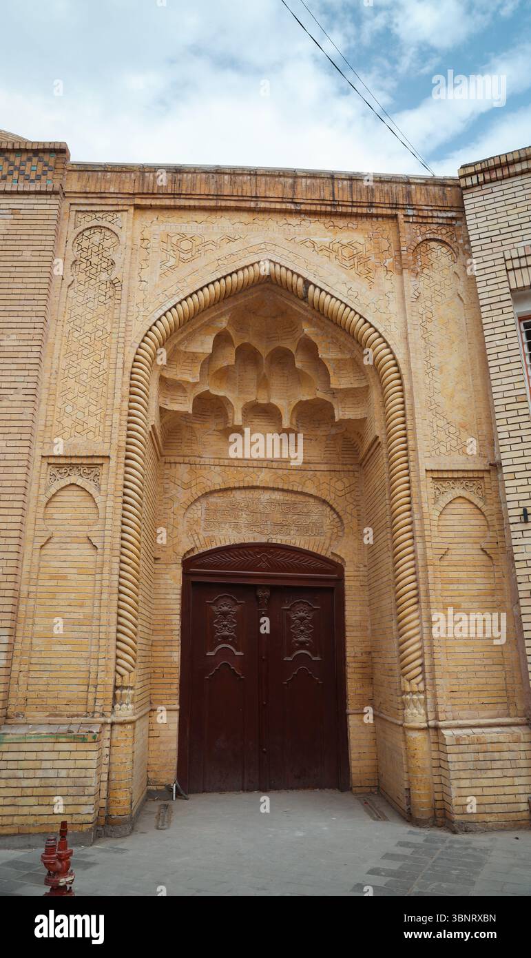 An ornate entrance of a historic Baghdad building showcases traditional ...