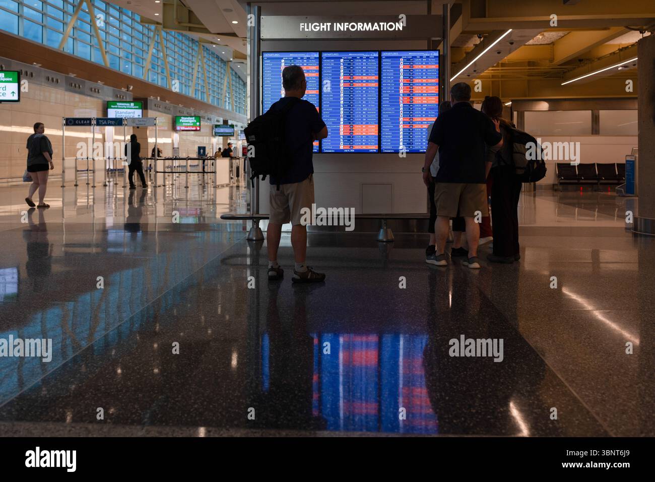 Arlington, Virginia, USA. 1st July, 2025. Travelers check the