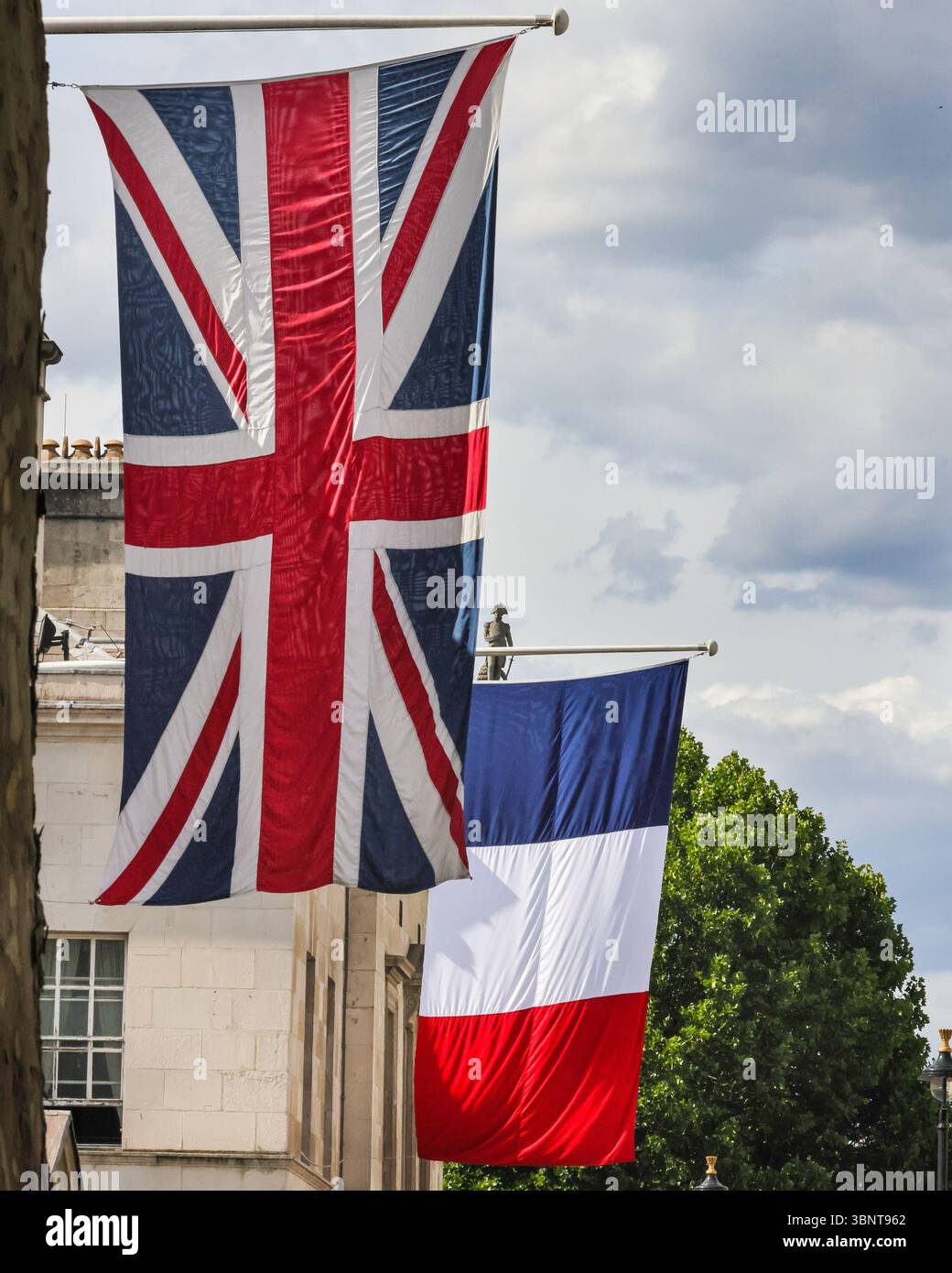 London, UK. 03rd July, 2025. The tricolour National Flag of France has been raised alongside the Union Jack Flag, the national flag of the United Kingdom, outside Horse Guards on Whitehall, in preparation for the State Visit by the President of France, Emmanuel Macron next week. Credit: Imageplotter/Alamy Live News Stock Photo