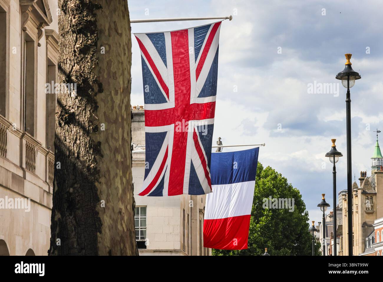 London, UK. 03rd July, 2025. The tricolour National Flag of France has been raised alongside the Union Jack Flag, the national flag of the United Kingdom, outside Horse Guards on Whitehall, in preparation for the State Visit by the President of France, Emmanuel Macron next week. Credit: Imageplotter/Alamy Live News Stock Photo