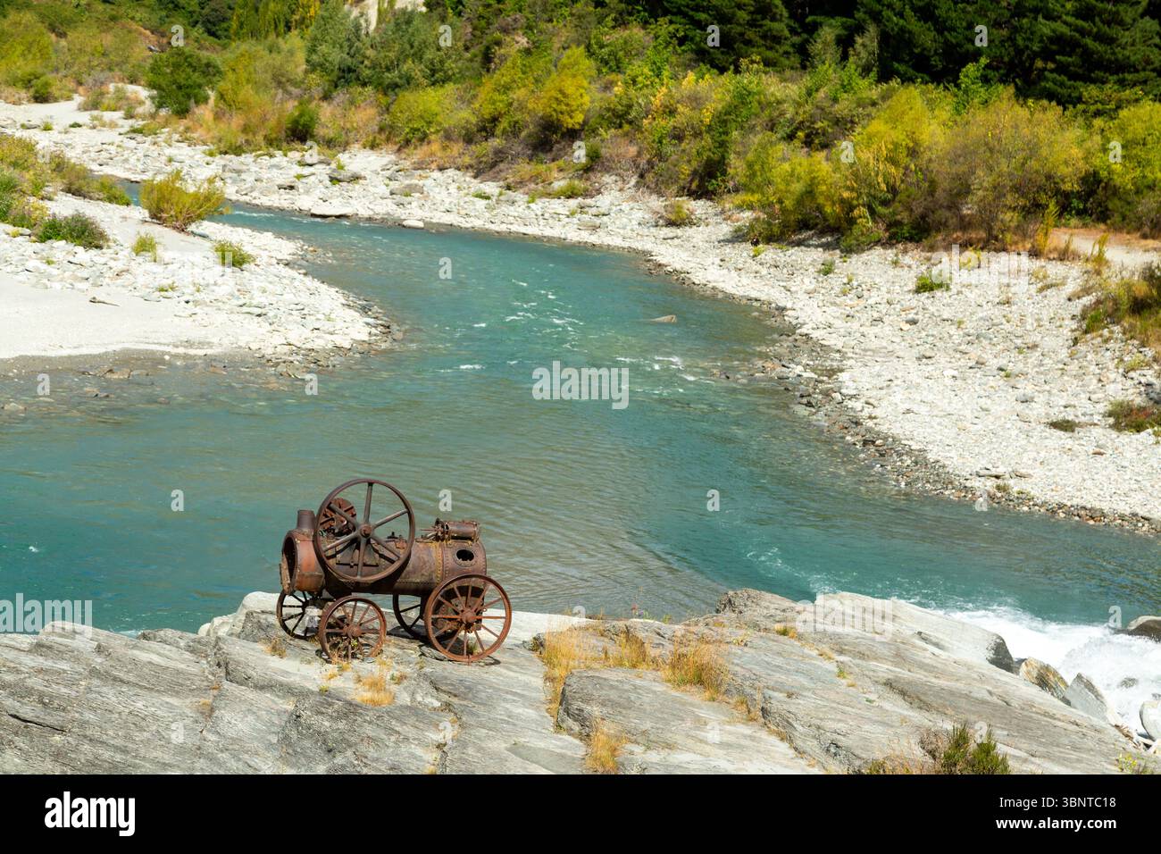 An old Steam engine from the gold rush on the Shotover River near ...