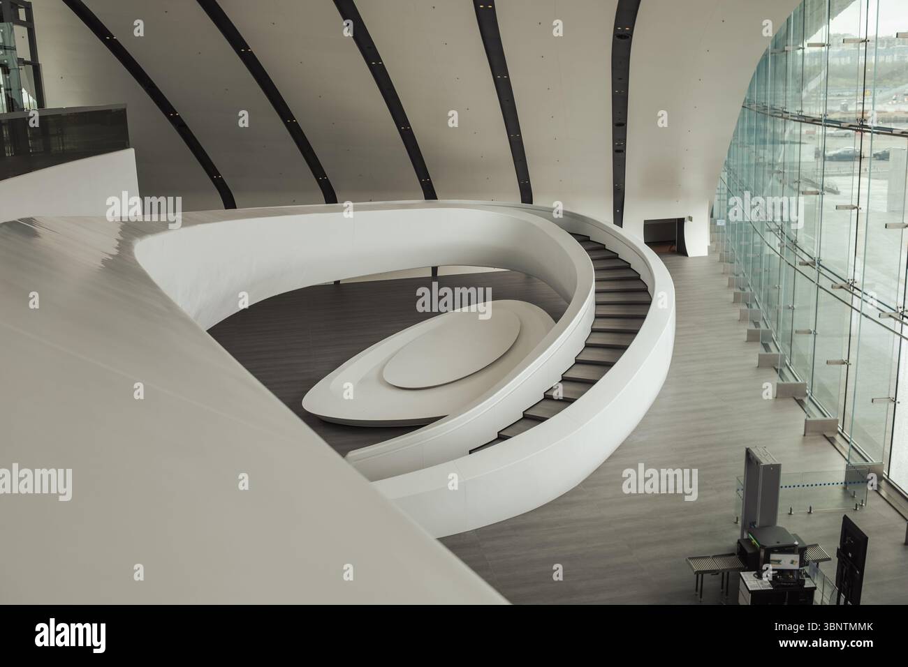 Modern Architectural Design Featuring a Curved Staircase and Expansive ...