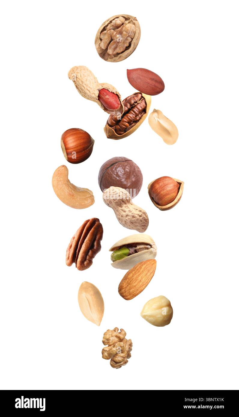 Peanut and other nuts falling on white background Stock Photo