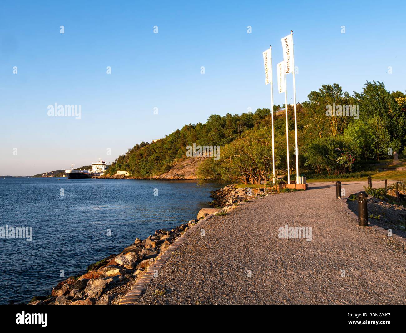 Stockholm, Sweden - June 3 2025: A scenic waterfront pathway lined with ...