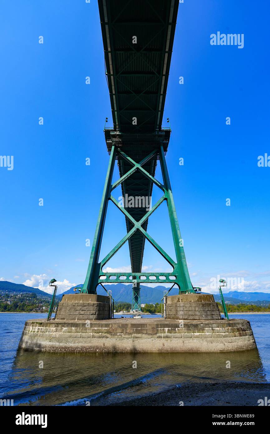 Pylon of the Lions Gate Bridge crossing the first narrows of Burrard Inlet from Stanley Park towards North Vancouver in British Columbia, Canada. Stock Photo