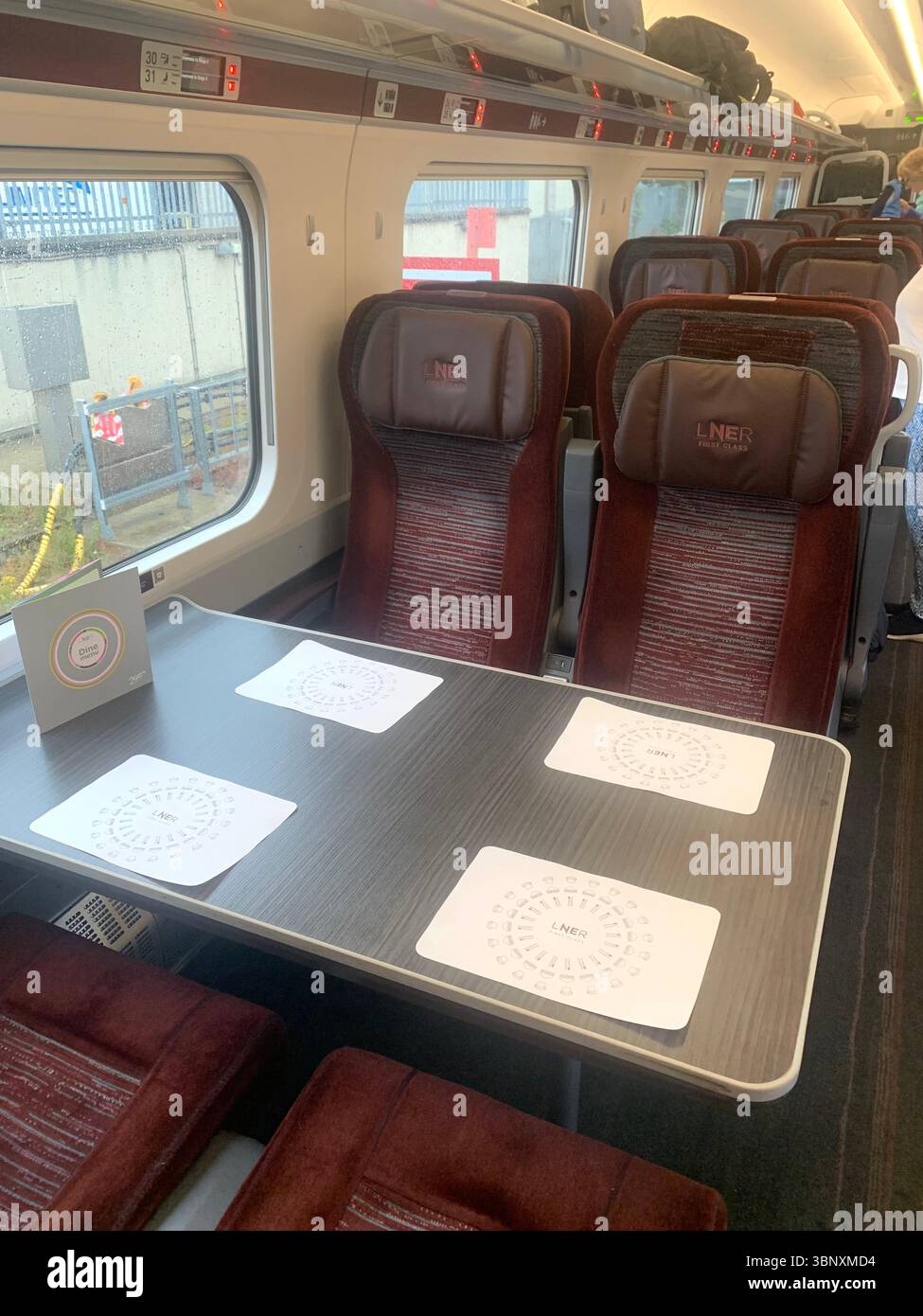 Train from Inverness to London Kings Cross railway Station first class people boarding waiter waitress holiday person people tourists suitcases UK - Smartphone Captured Stock Image