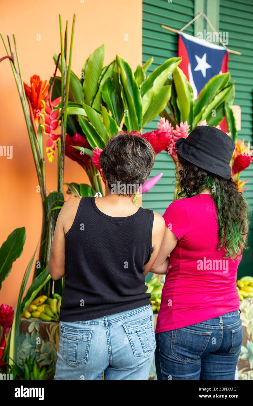 Puerto Rico Display Women at flower and fruit display, Farmers Market, Museo de San Juan ...