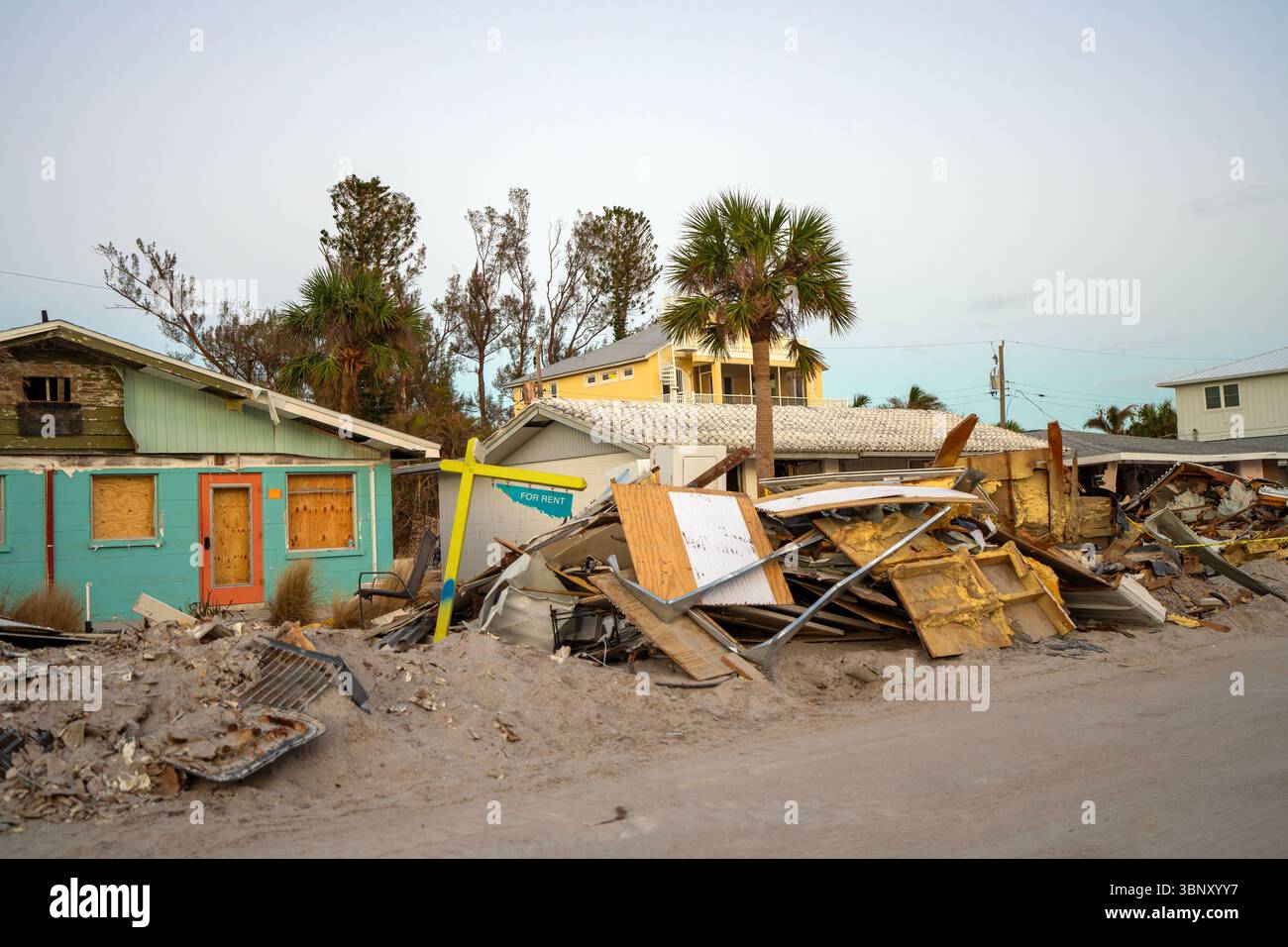 Piles of debris on street side after hurricane Milton on Manasota key ...