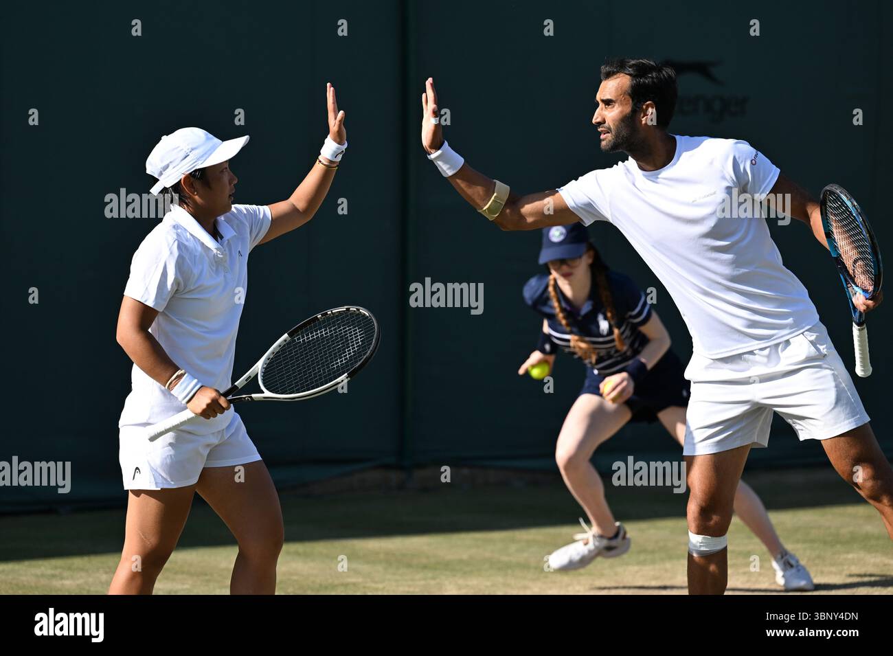 London, Britain. 4th July, 2025. Jiang Xinyu (L)/Yuki Bhambri react ...