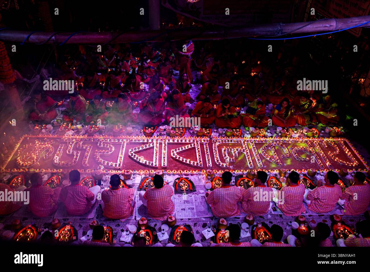 A Ritual Celebration Example Participants in traditional attire perform rituals with candles during ...