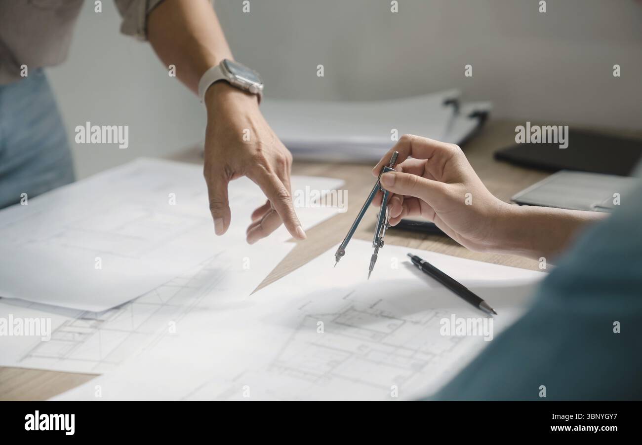 Man architect working On the desk construction project ideas architects engineer Concept Stock Photo