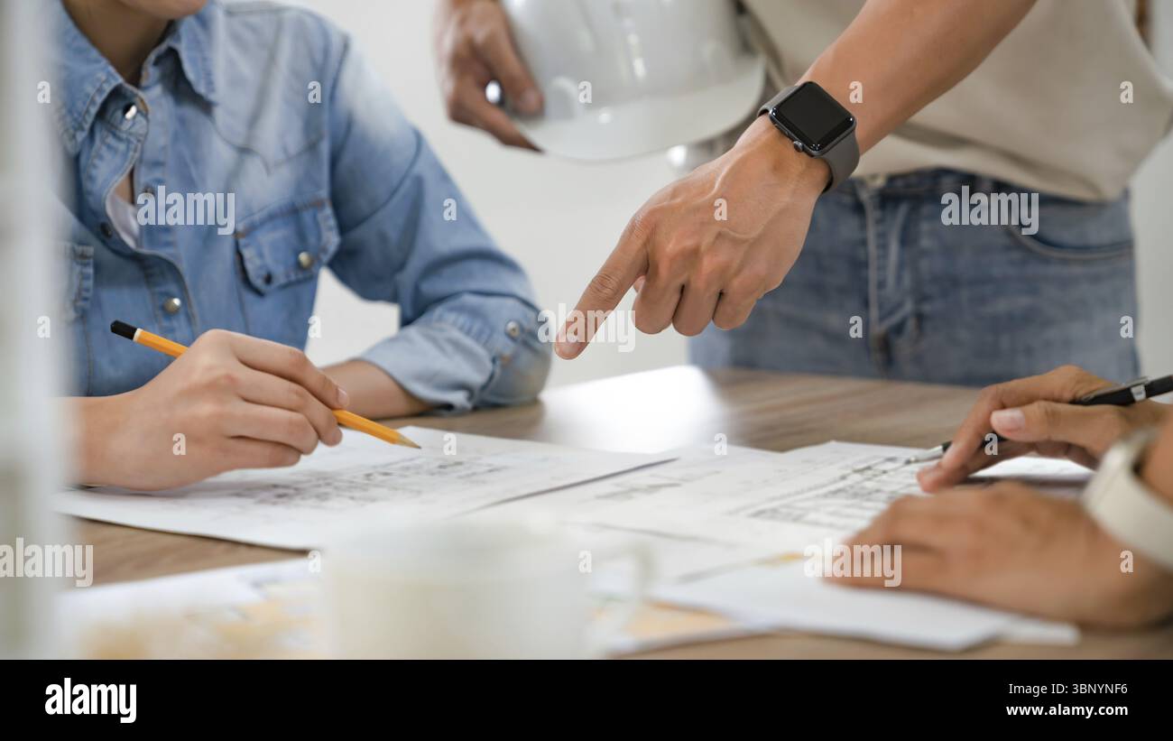 Man architect working On the desk construction project ideas architects engineer Concept Stock Photo