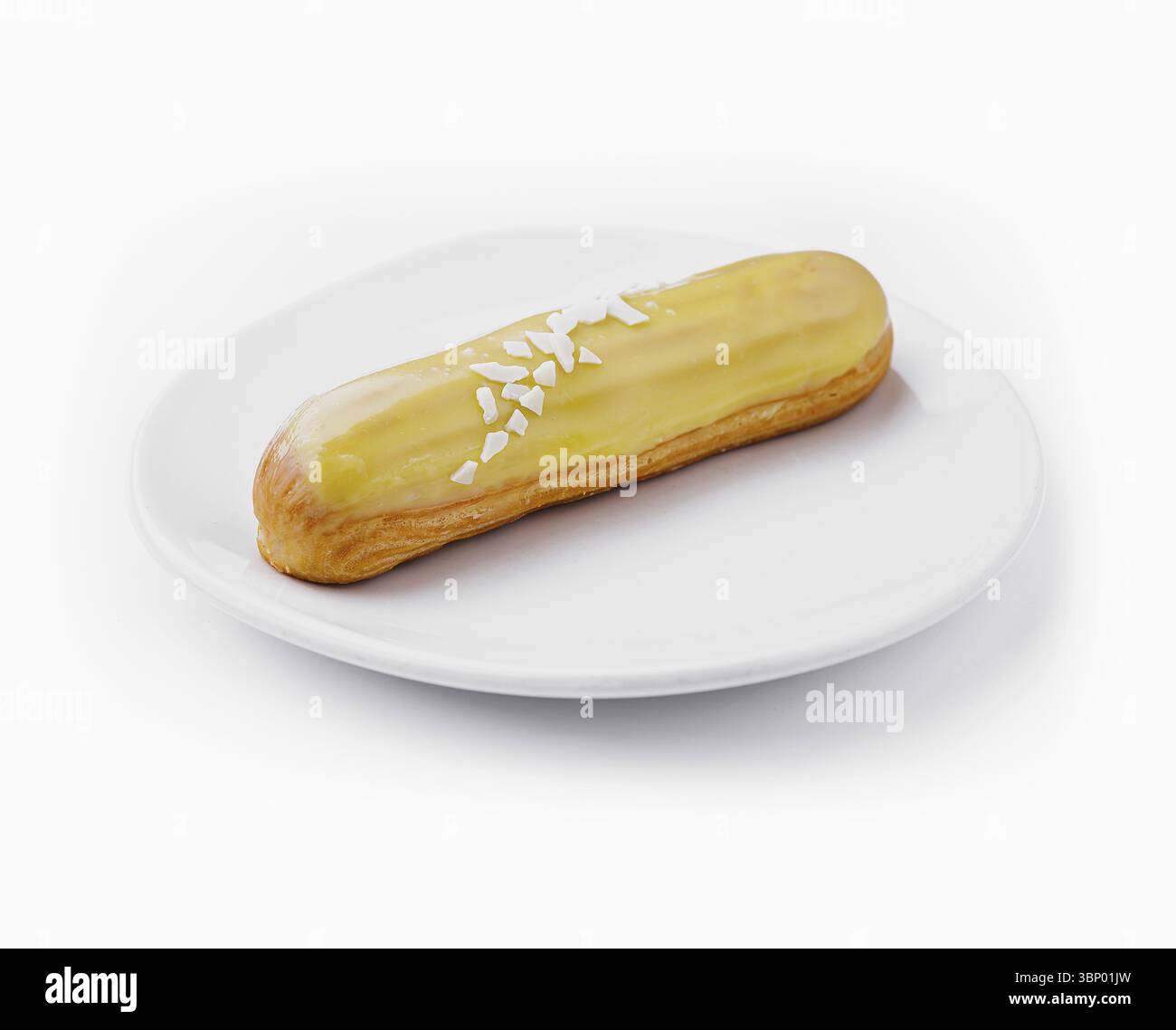 Delicious eclair with custard on plate top view Stock Photo
