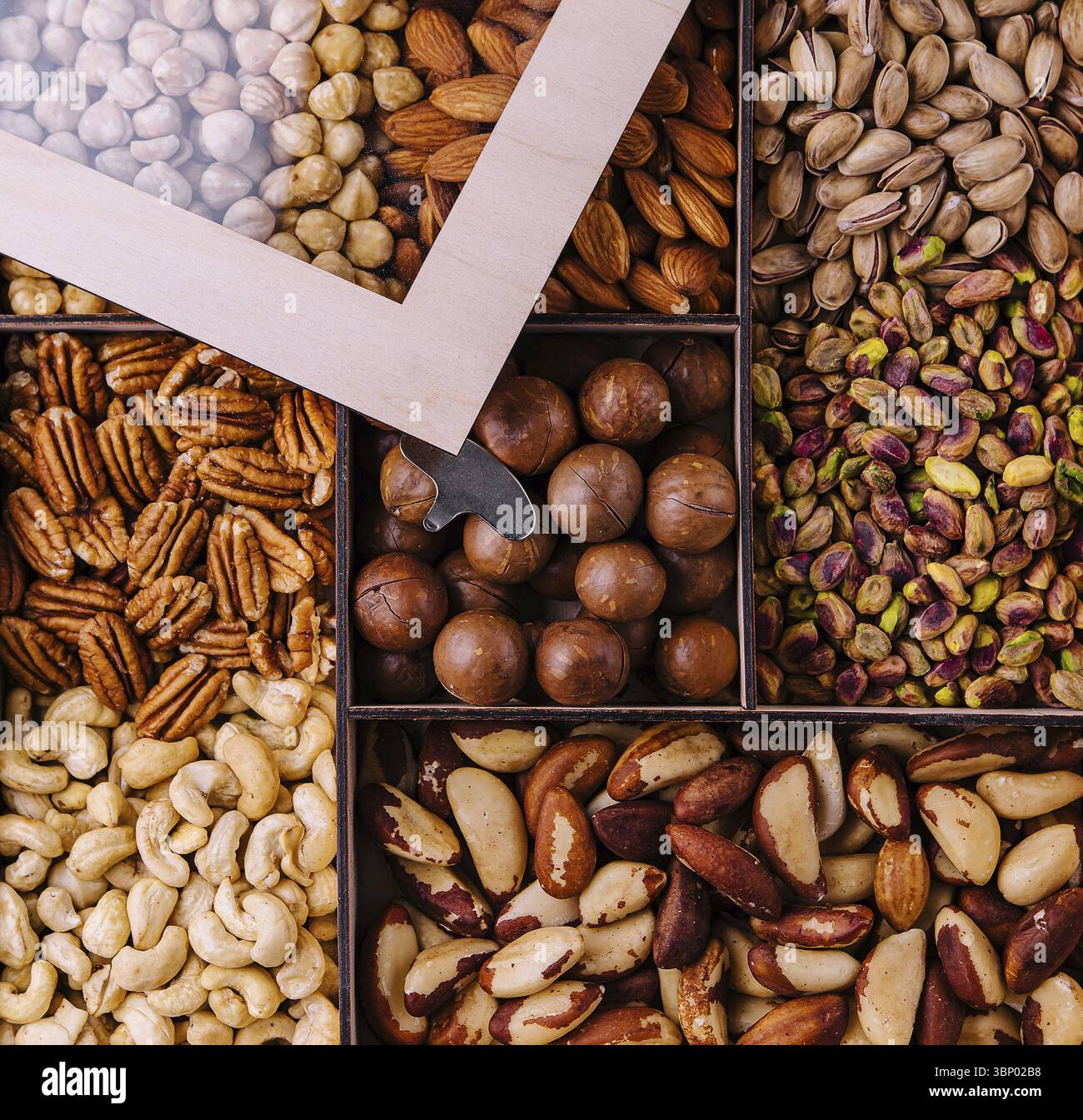 Assorted nuts in a wooden box Stock Photo