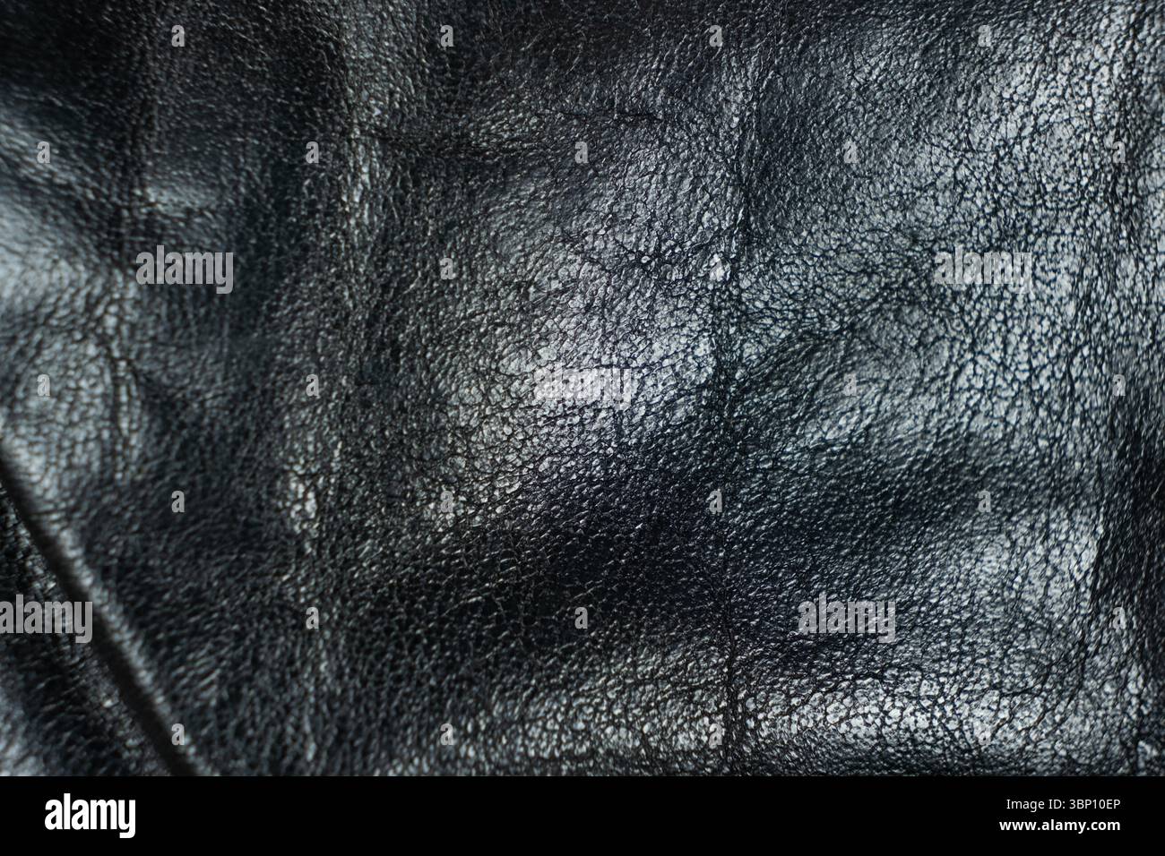 Minimalist Black Leather Texture Close-Up. Stock Photo