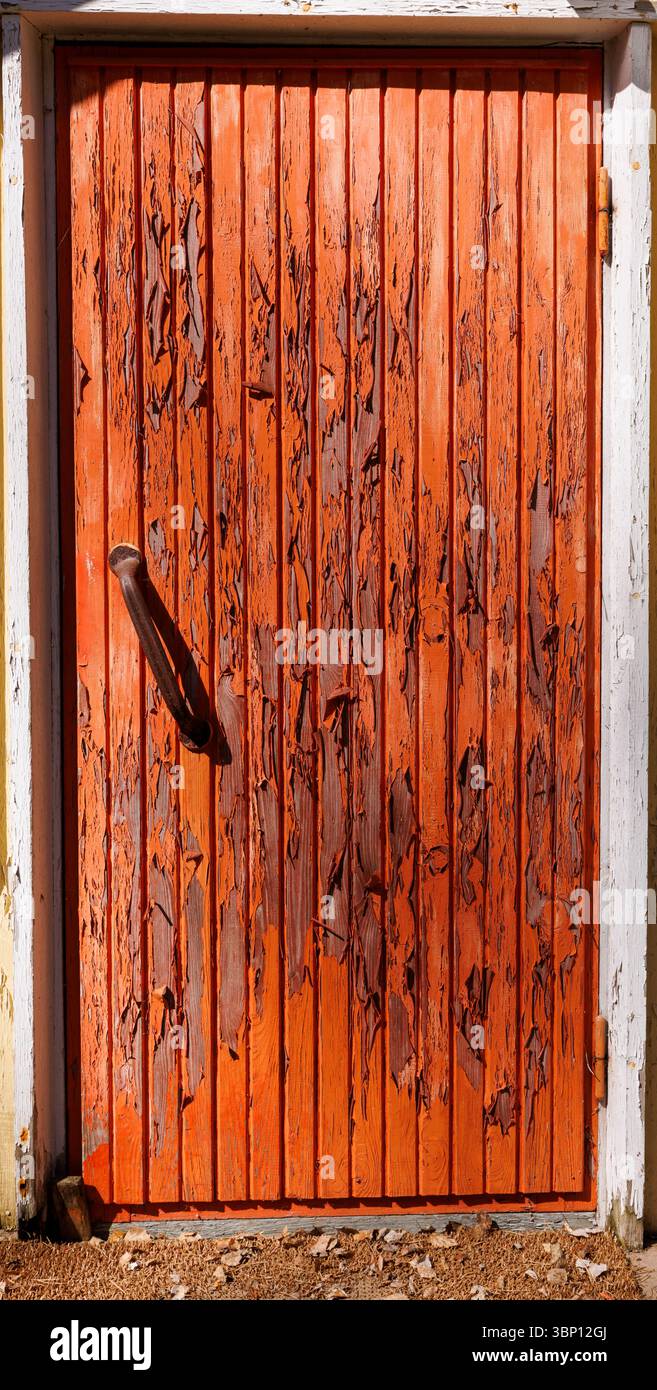 Paint peels off from an old wooden door, Finland Stock Photo