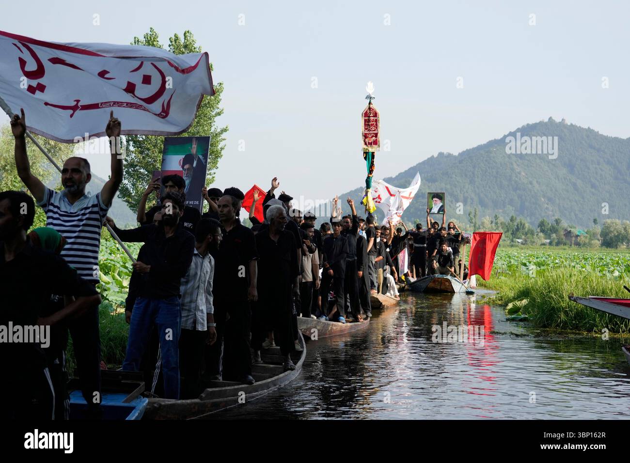 Kashmiri Shiite Muslims shout religious slogans as they participate in ...