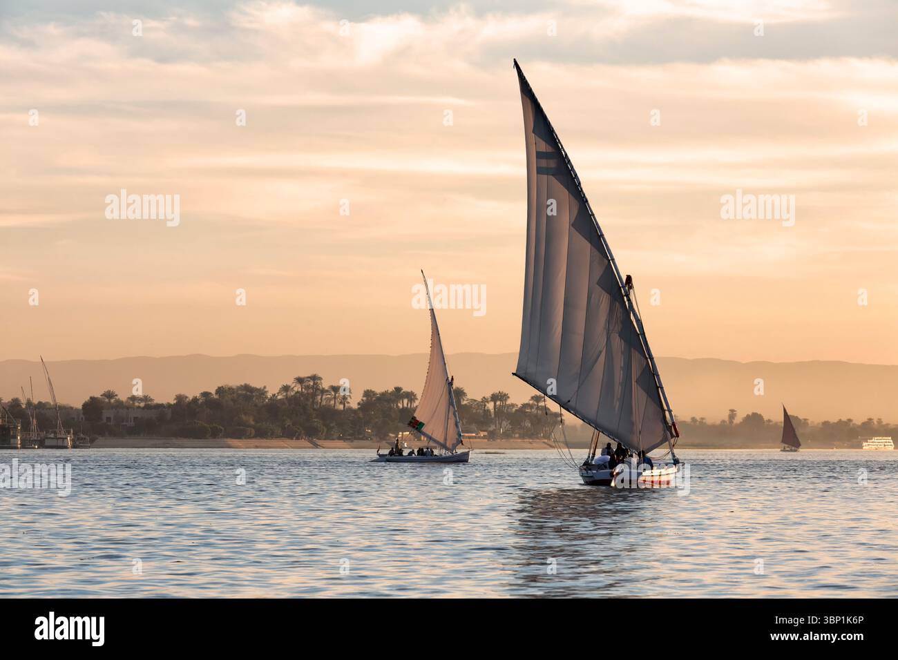 Tourists in a Felucca boat on the Nile River in Luxor Thebes - Egypt ...